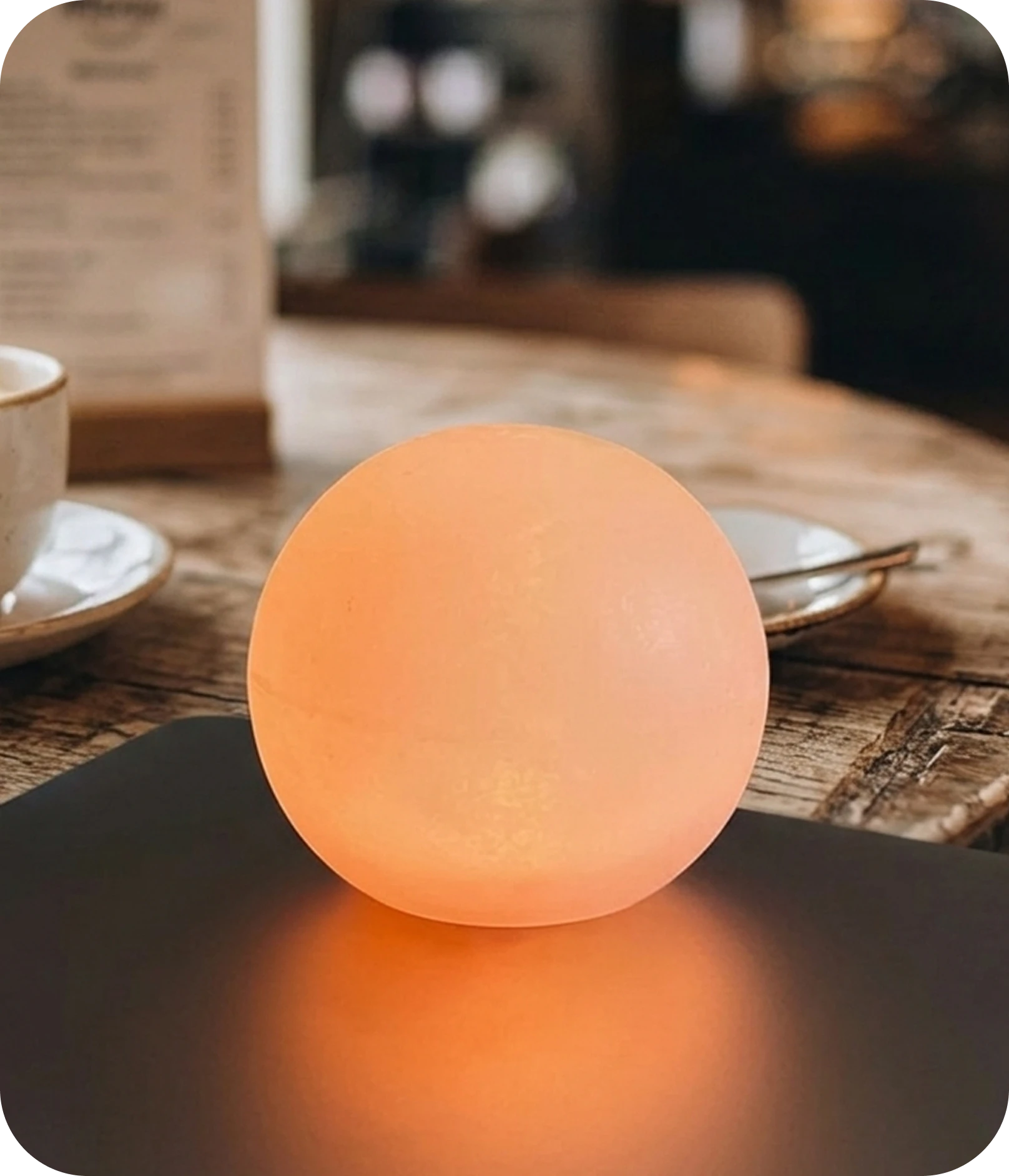 SomaSeed resting on a table, glowing softly
